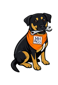 black and brown dog with an orange bandana that says 'HM&co' and holding a wrench in its mouth
